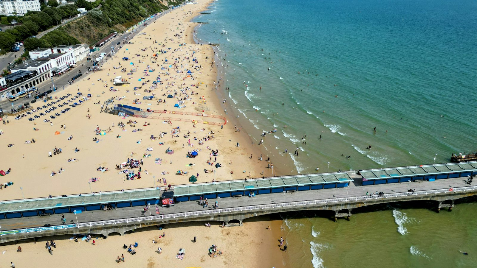 Aerial view of Bournemouth Pier and beach on a sunny day