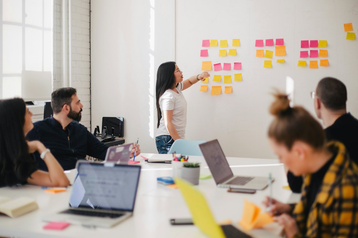 Team workshop with sticky notes on a wall